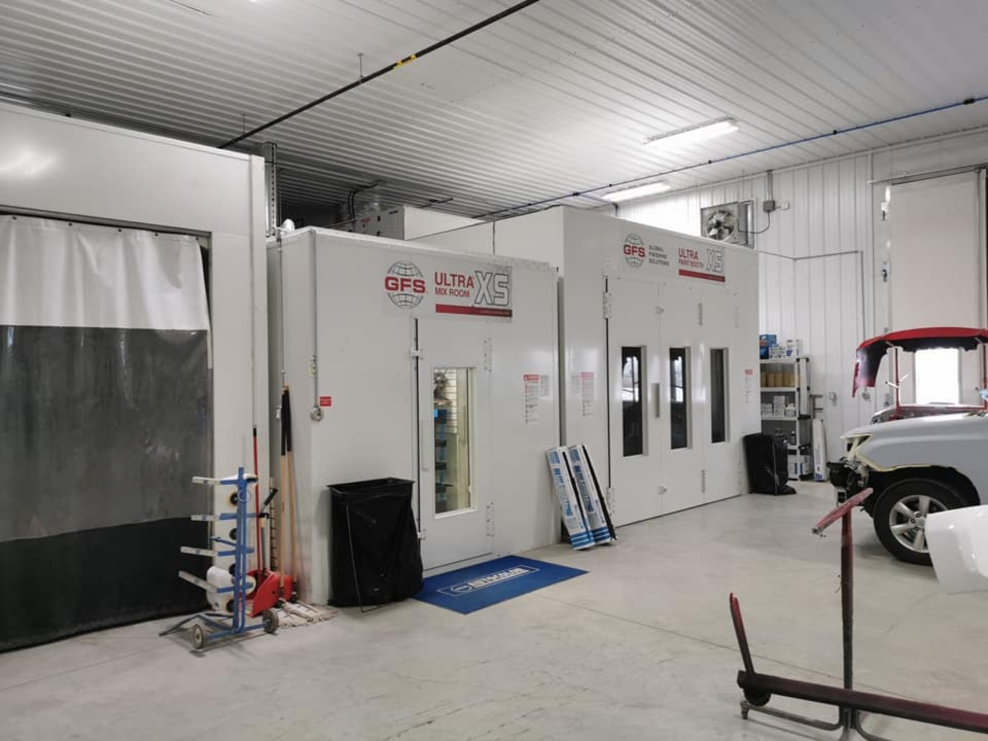Vehicle masked and prepped inside the Magic Paint & Body refinishing booth